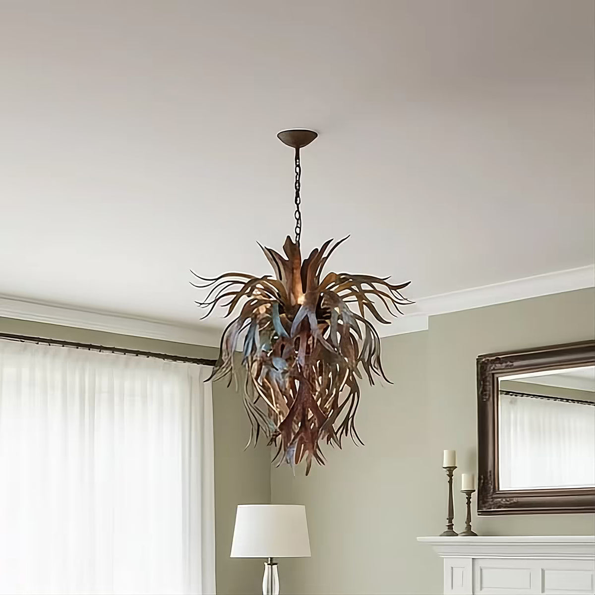 Platycerium. Our premier sculptural chandelier made of hand-forged metal shaped like staghorn fern fronds in our signature torched-copper finish, hanging from a matching chain against a neutral background