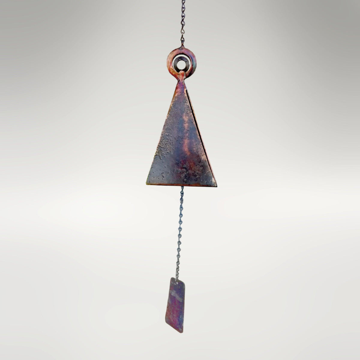 35-inch Santa Maria Mission Bell by Marc Staples: A large, three-sided hand-forged steel sound sculpture featuring a vibrant torched-copper patina and monogrammed striker.