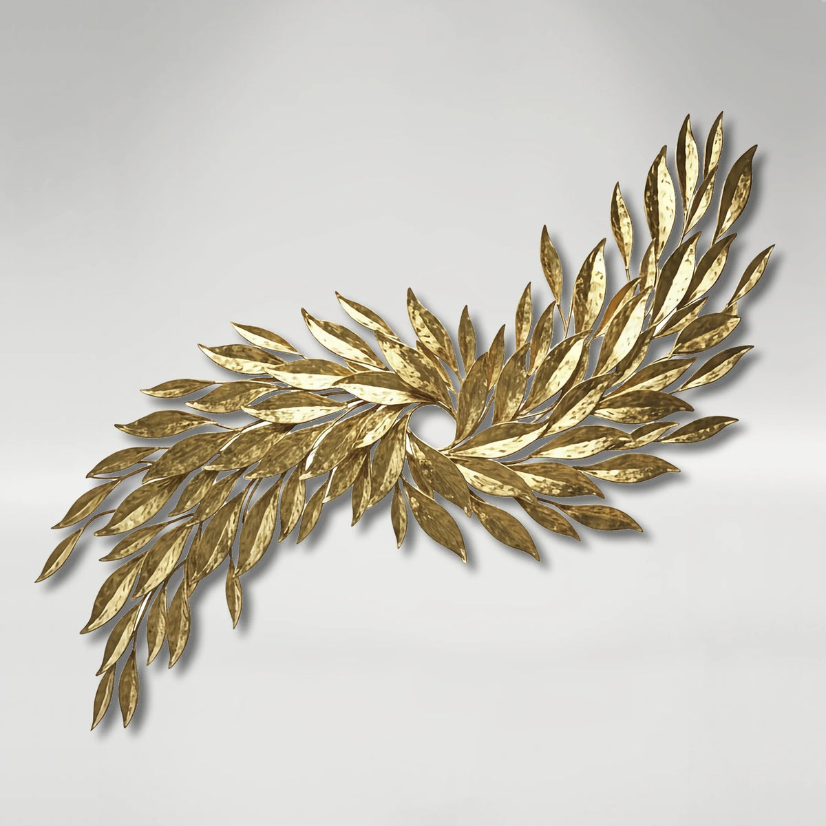 Golden Fiesta. A gold tobacco leaf wall sculpture on a light gray background