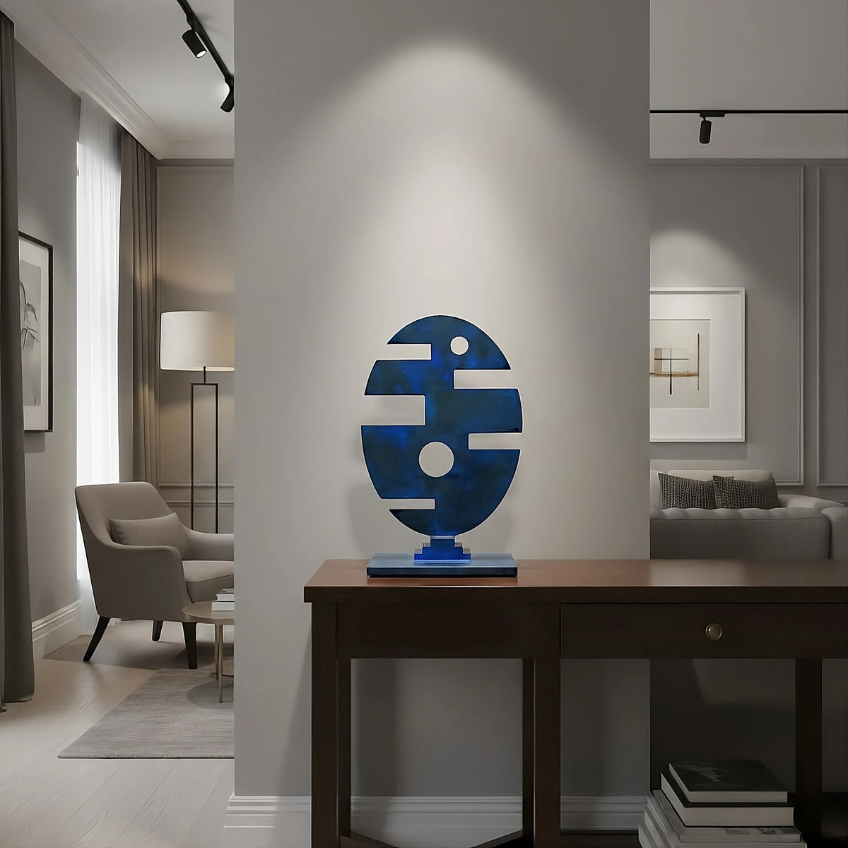 Abstract steel tabletop sculpture by Marc Staples, finished in powder-blue bronze, set on a modern accent table.