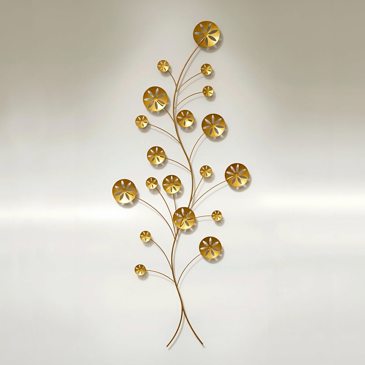 Wall sculpture titled Gold Coast featuring 19 metal sand dollars. 