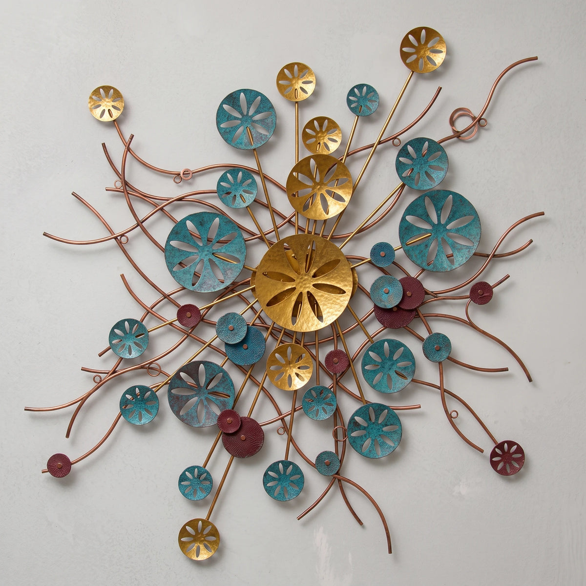 Tidal Rhythm mixed-media metal wall sculpture in gold, teal, burgundy, and copper. 