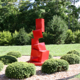 An outdoor metal sculpture titled The Past is Prologue at Birdland